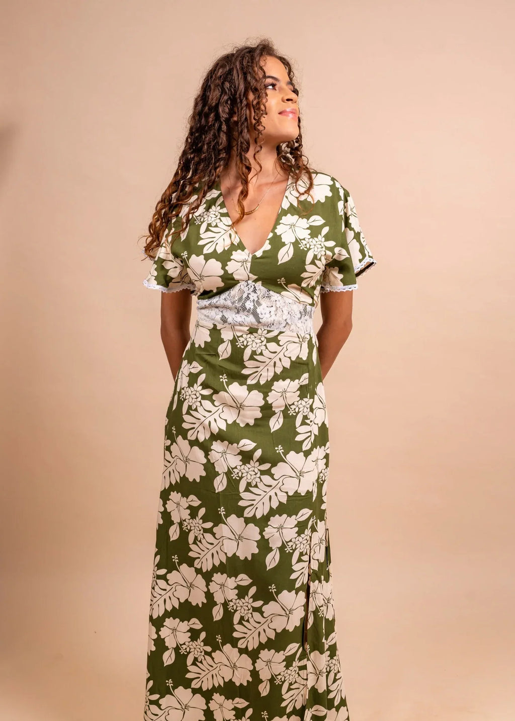Women wearing a fabulous polynesian dress in green olive color with hibiscus pattern