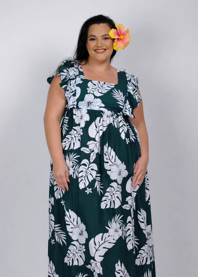 Woman wearing the Green Empire Hokulani dress