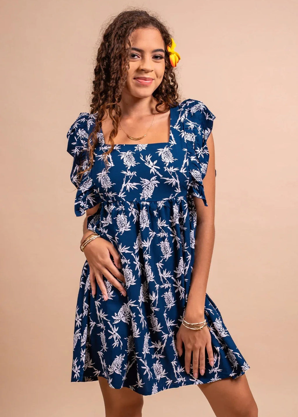Women with cute bamboo kultur Hokulani XS dress in blue navy color with pinaeple pattern