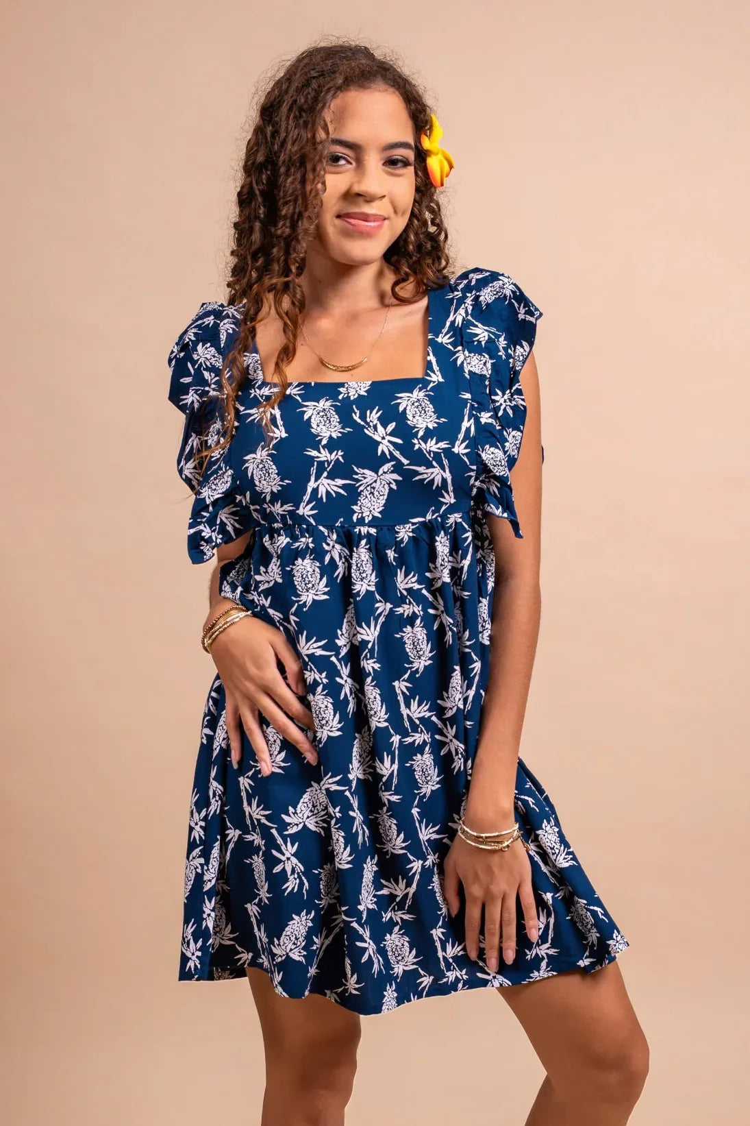 Women with cute bamboo kultur Hokulani XS dress in blue navy color with pinaeple pattern