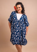 Women wearing a cute polynesian dress in navy blue color with pinaeple pattern