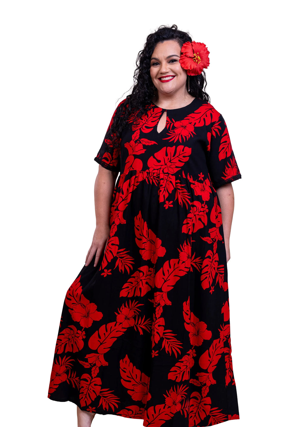 Rea Wearing the Maia Bamboo kultur dress in Black and Red hibiscus patterns