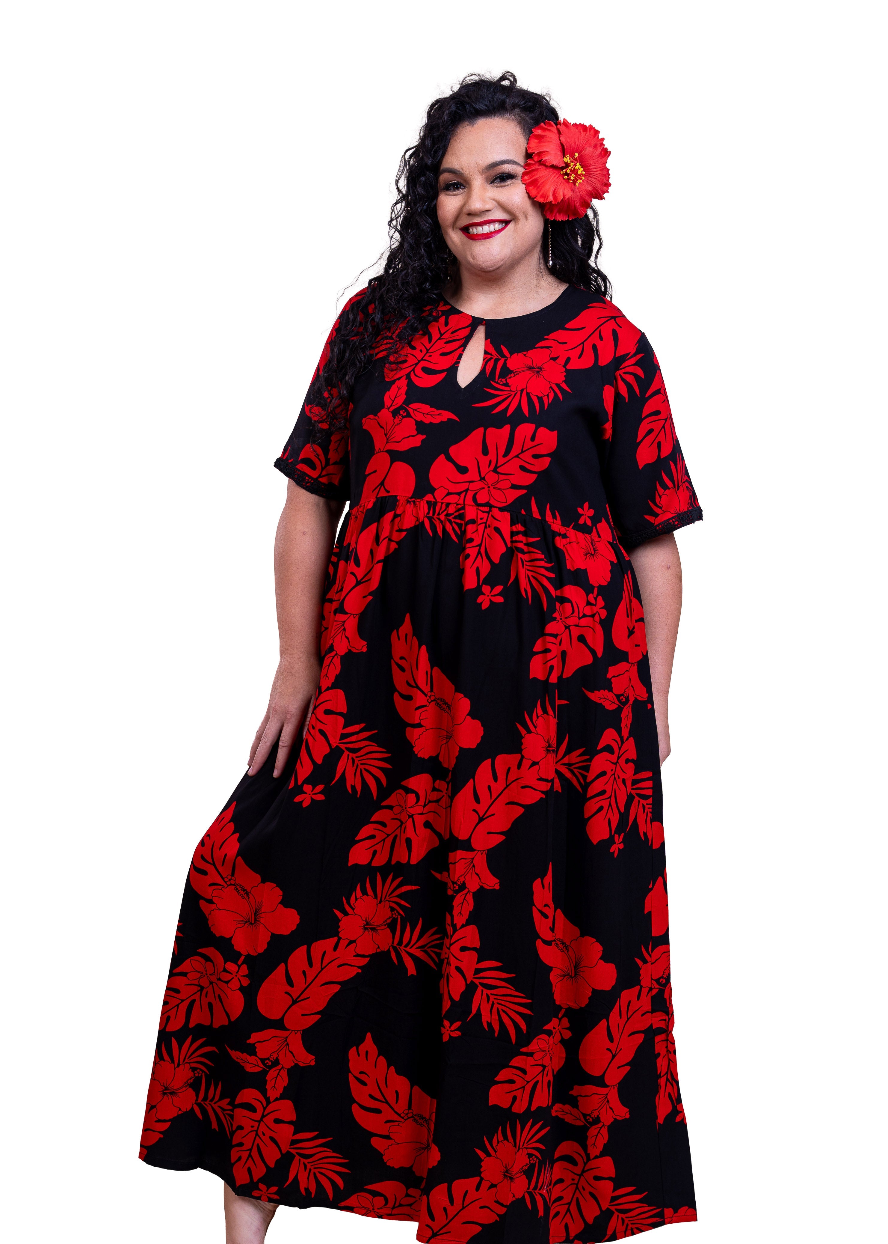Rea Wearing the Maia Bamboo kultur dress in Black and Red hibiscus patterns