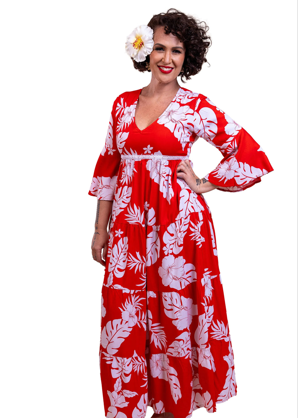 Woman wearing the Merahi long red hibiscus dress