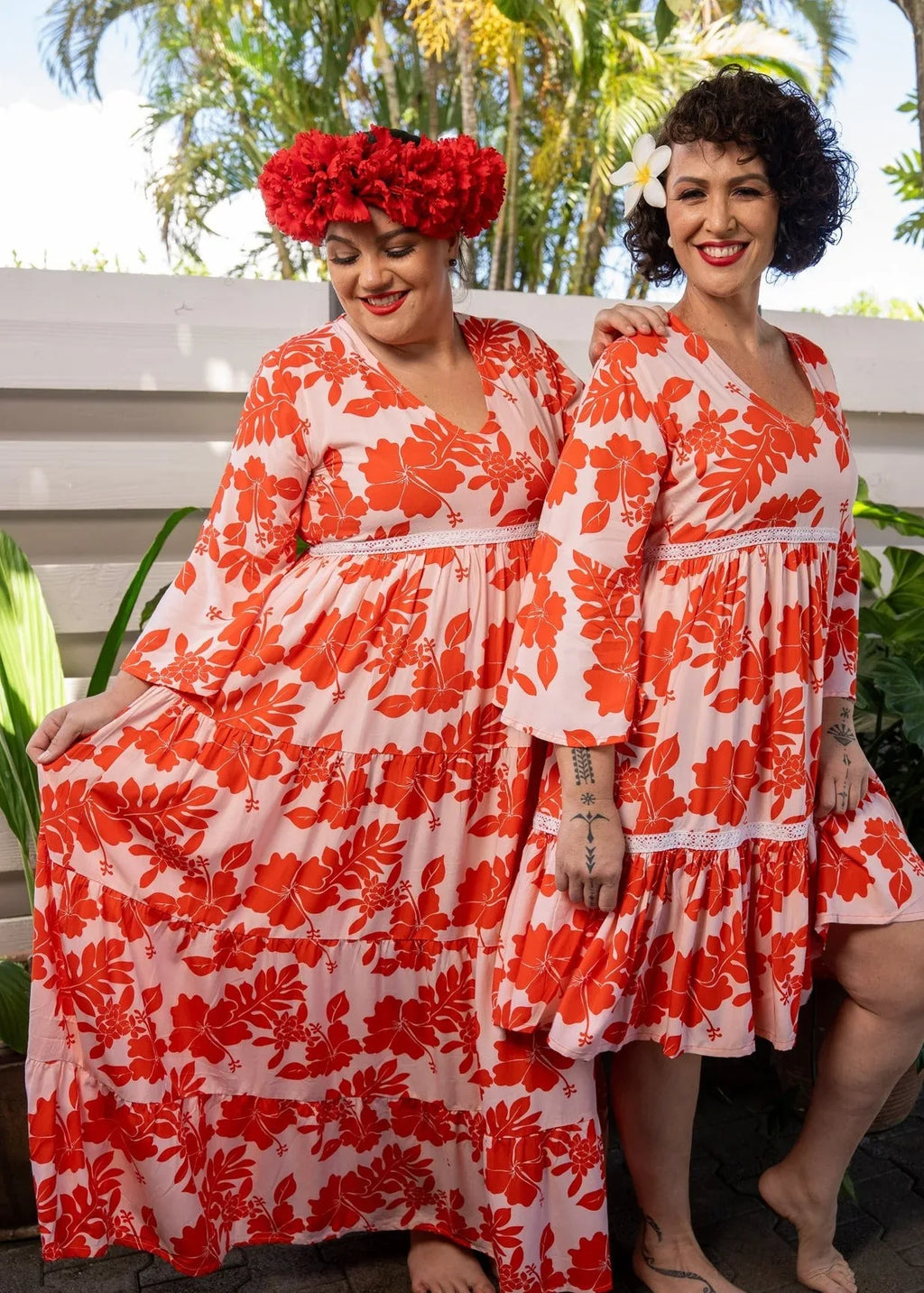 Women wearing the Merahi long and short coral dress