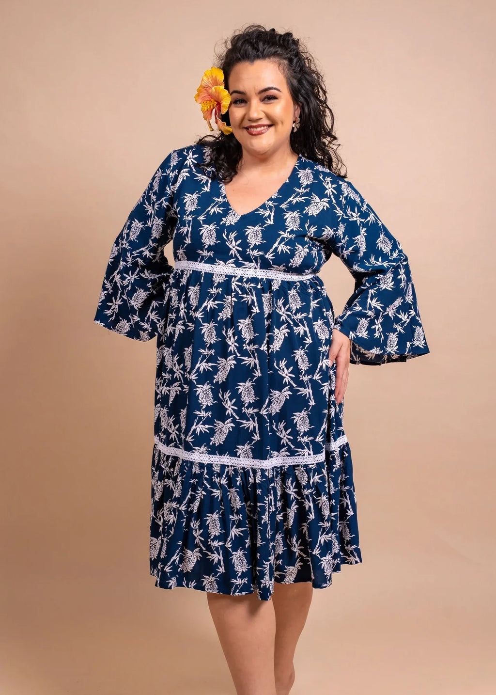 Women with cute Merahi bamboo kultur polynesian dress in blue navy color with Pinaeple pattern