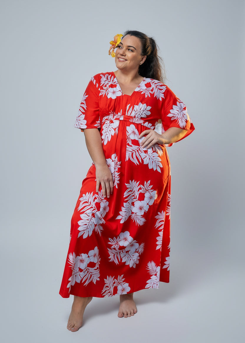 Rea Wearing the Tahia Bamboo kultur dress in red and white hibiscus patterns