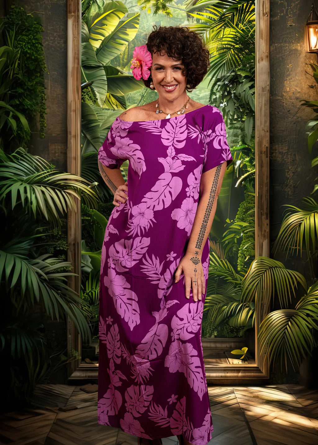 Women with a beautiful pink hibiscus on her ear wearing a long polynesian dress in Purple color with hibiscus pattern