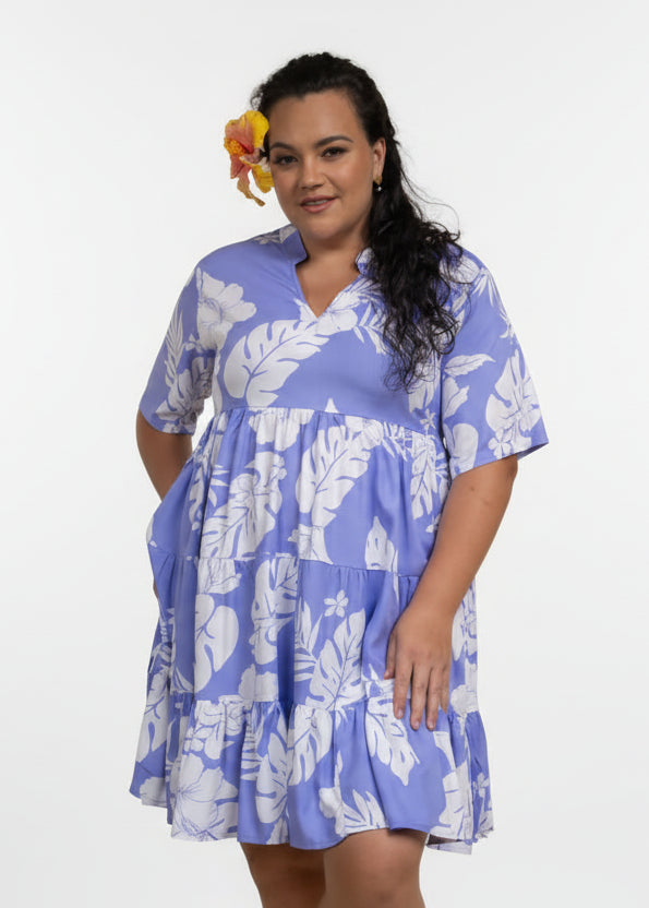 Women wearing Bamboo Kultur’s “Vaihere” purple floral Polynesian dress in a short version