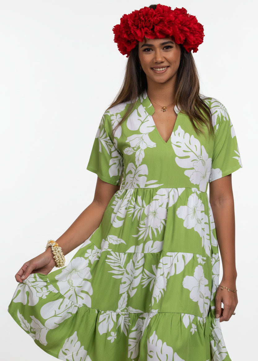 Women wearing Bamboo Kultur’s “Vaihere” green floral Polynesian dress in a short version